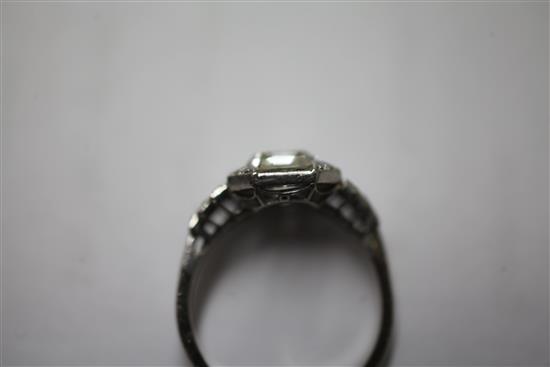 An Art Deco platinum single stone diamond and sapphire octagonal dress ring, size M.
